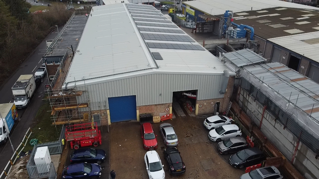 Aerial drone view of a CRE industrial roof refurbishment in progress